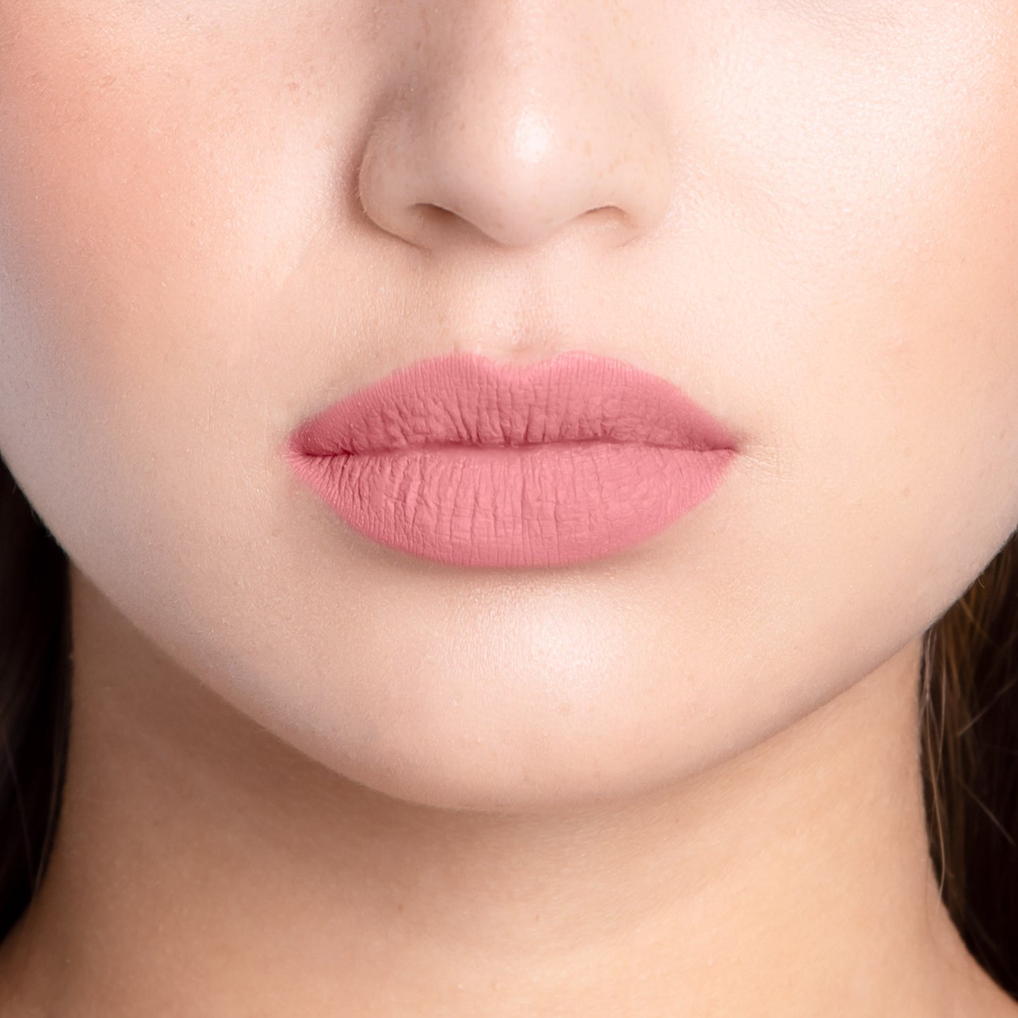 Closeup of a girls lips wearing LIPSAX in Undressed