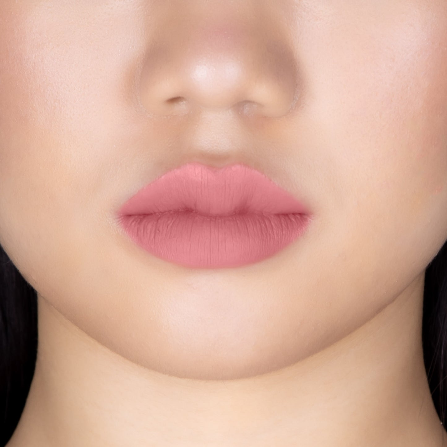 Closeup of a girls lips wearing LIPSAX in Undressed